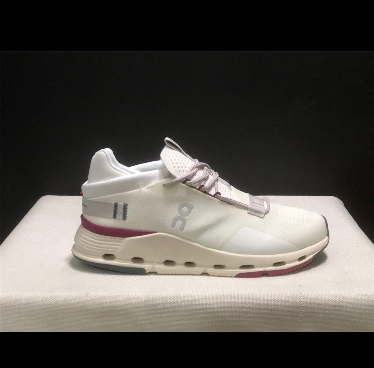 White and pink/purple tennis shoes