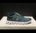 Dark green tennis shoes