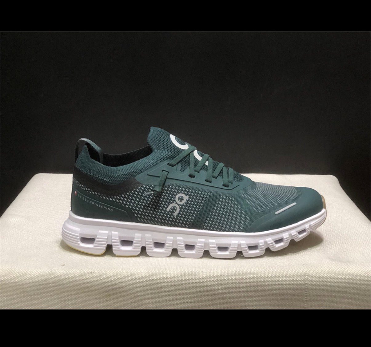 Dark green tennis shoes